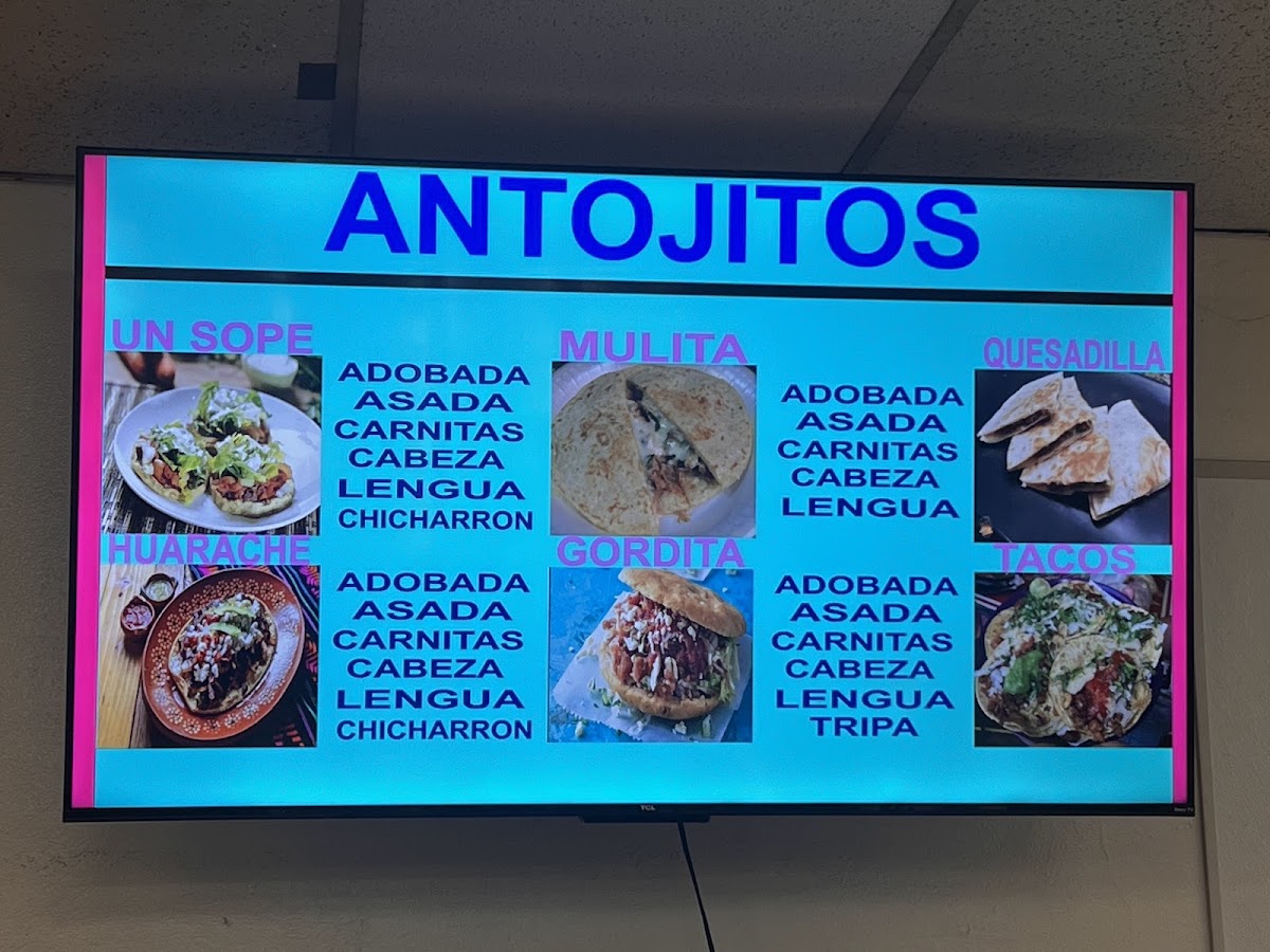 Sabroso taco savor a mi tierra menu board