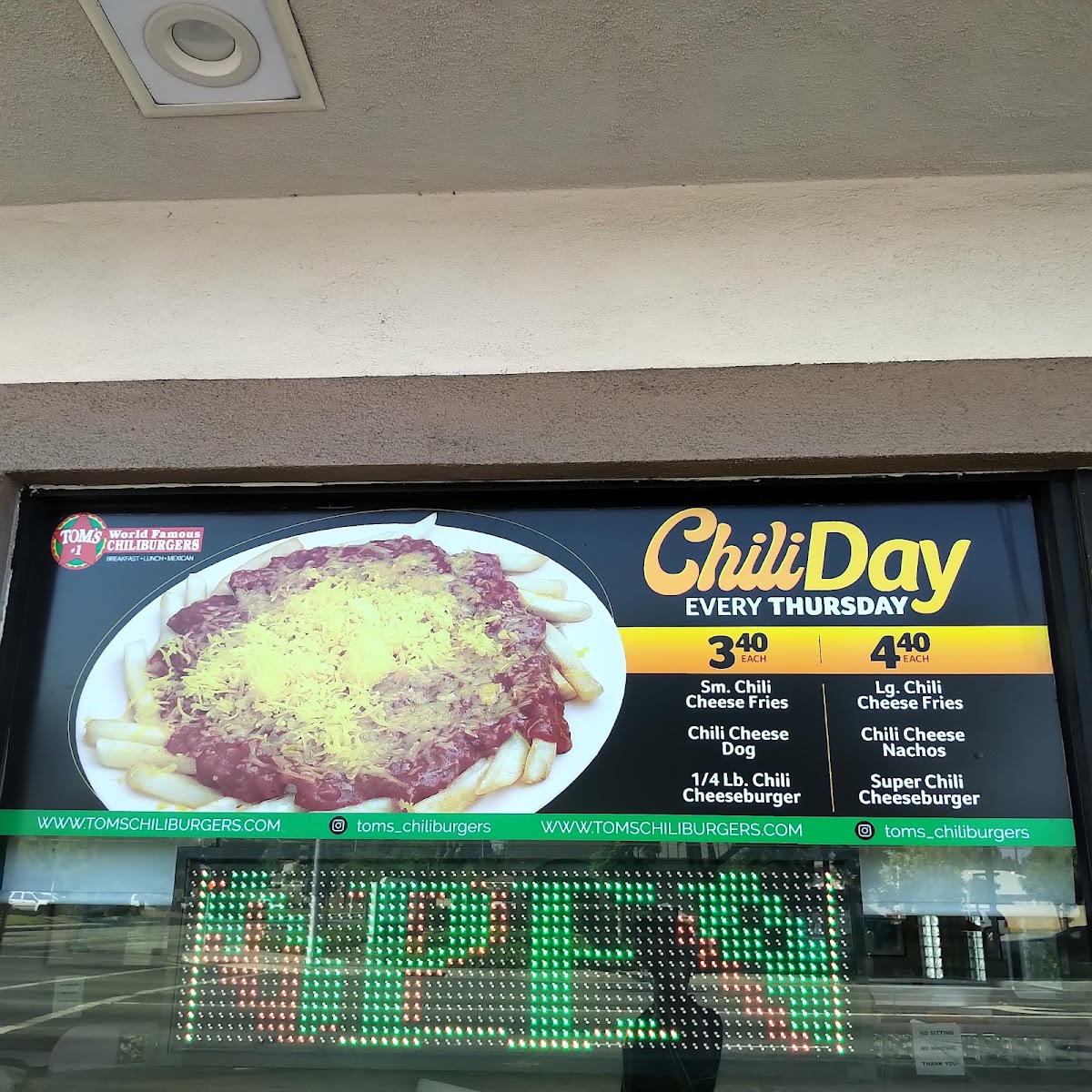 Tom's #1 World Famous Chili Burgers menu board