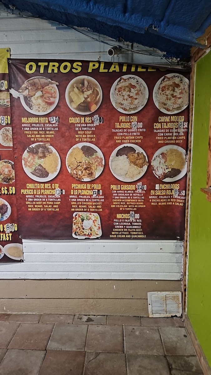 Tacos Y Pupusas menu board
