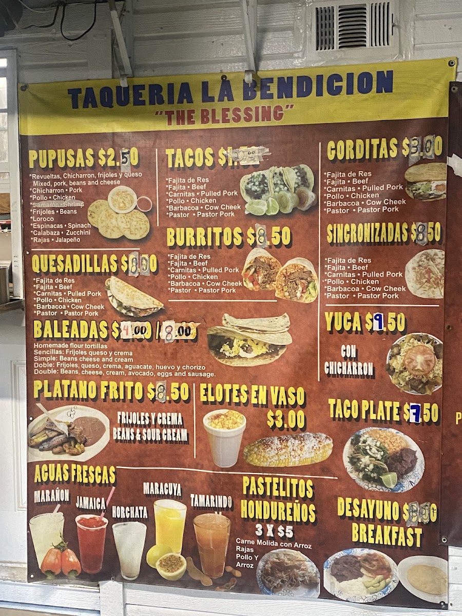 Tacos Y Pupusas menu board