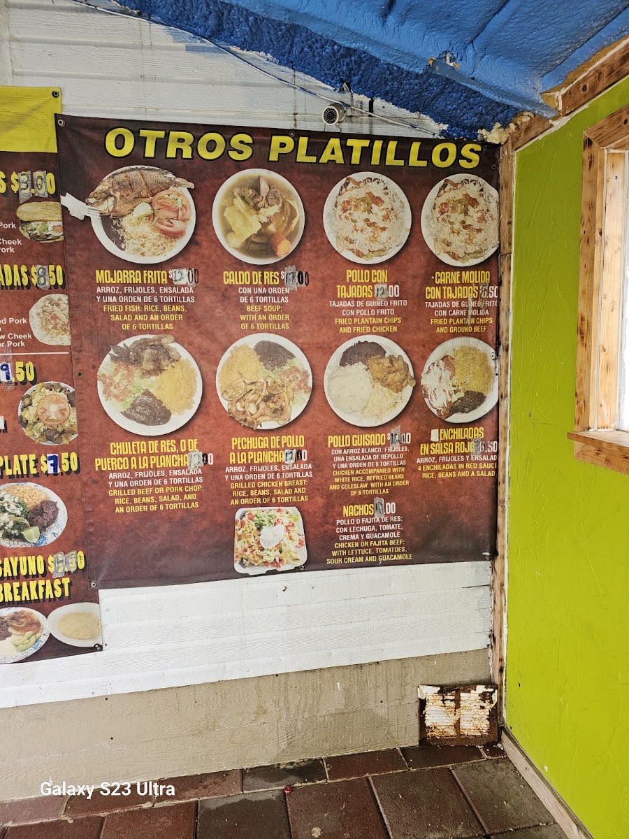 Tacos Y Pupusas menu board