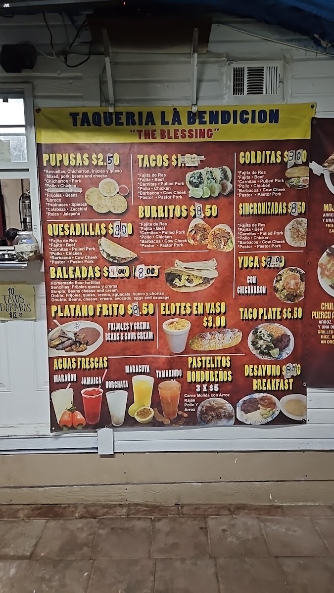 Tacos Y Pupusas menu board