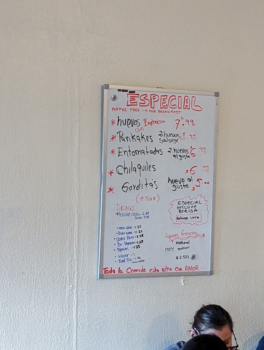 Antojitos Mi Reynita menu board