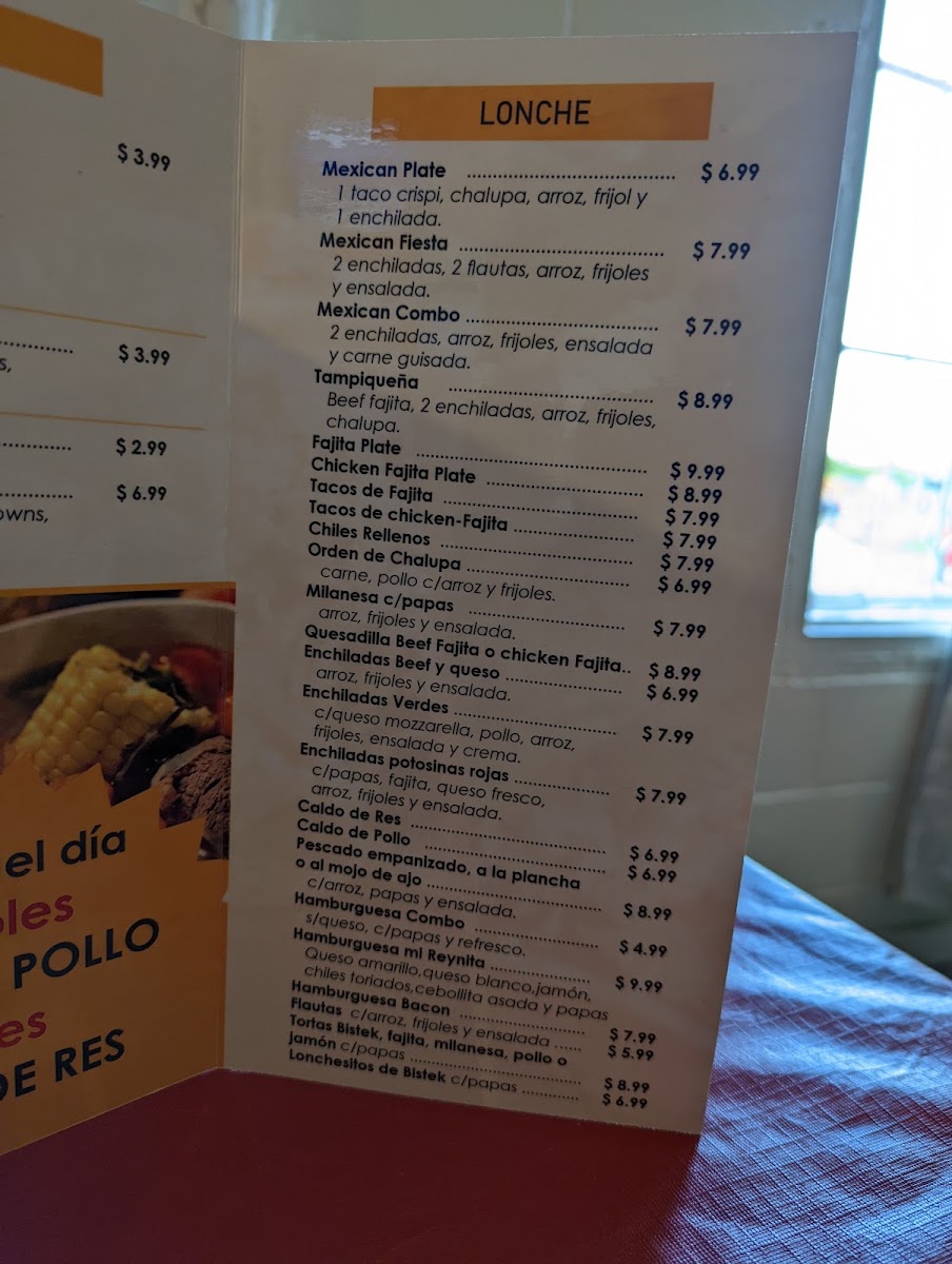 Antojitos Mi Reynita menu board