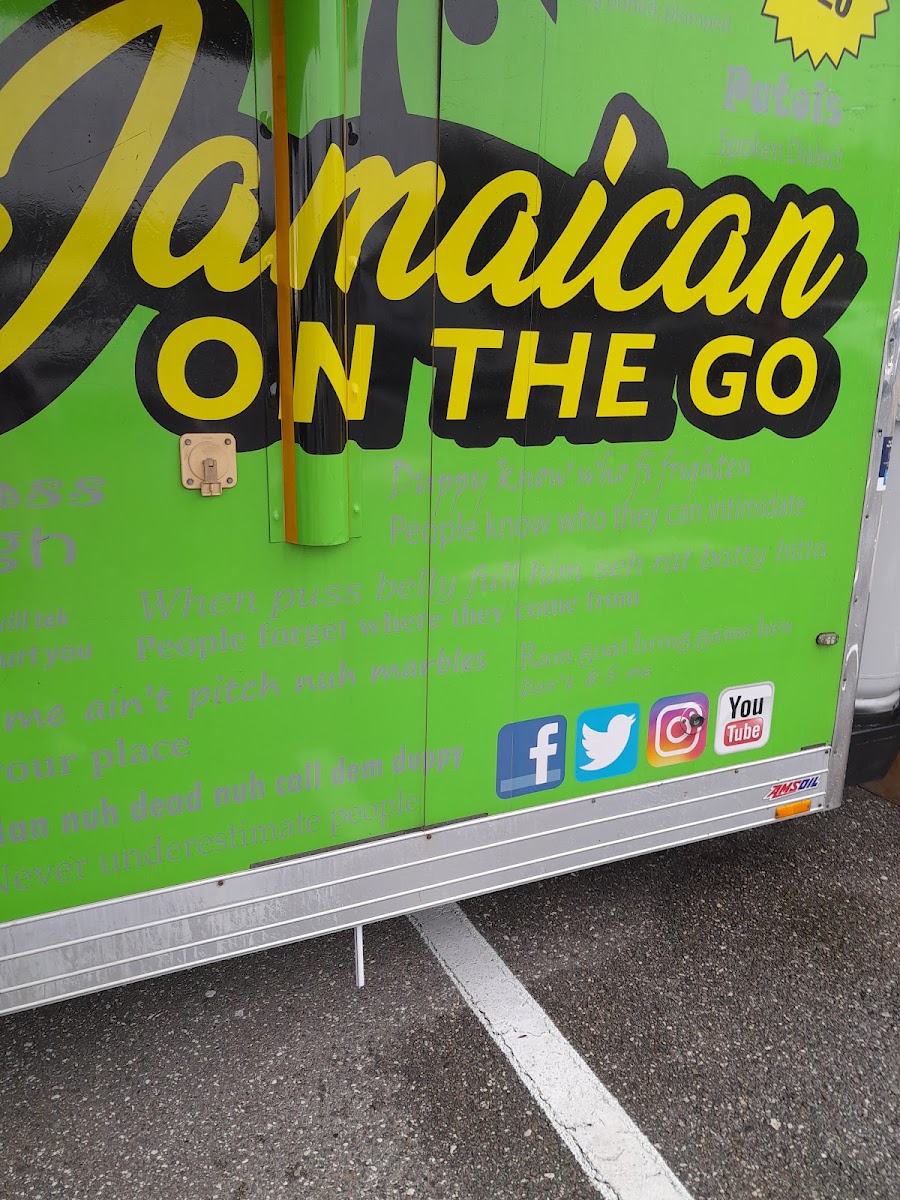 Jamaican On The Go Food Truck menu board