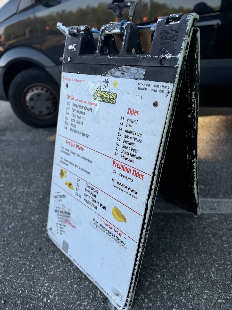 Jamaican On The Go Food Truck menu board