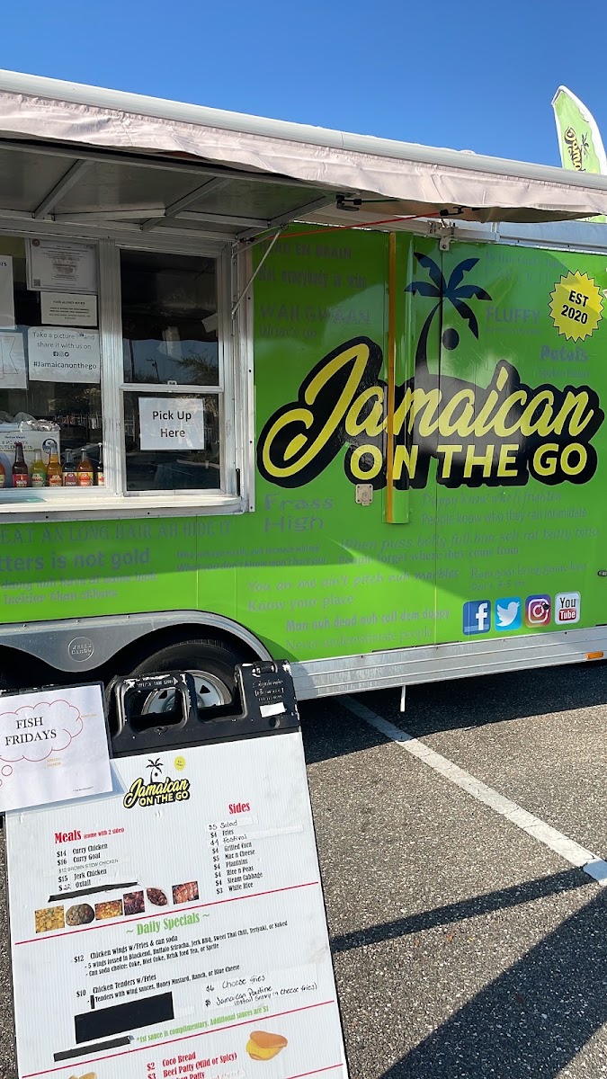 Jamaican On The Go Food Truck menu board