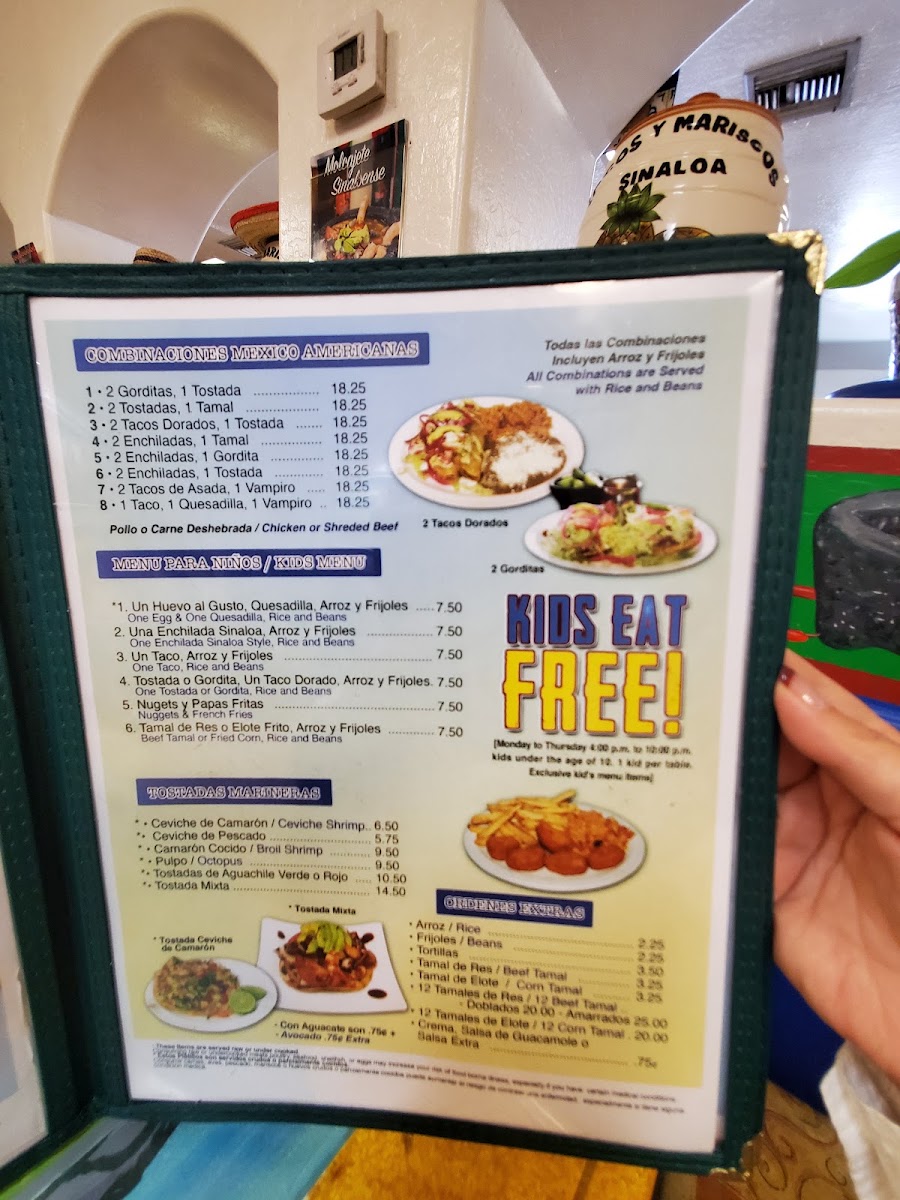 Tacos y Mariscos Sinaloa menu board