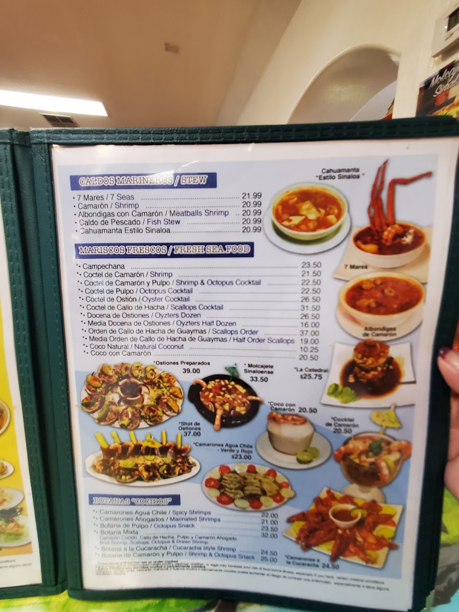 Tacos y Mariscos Sinaloa menu board