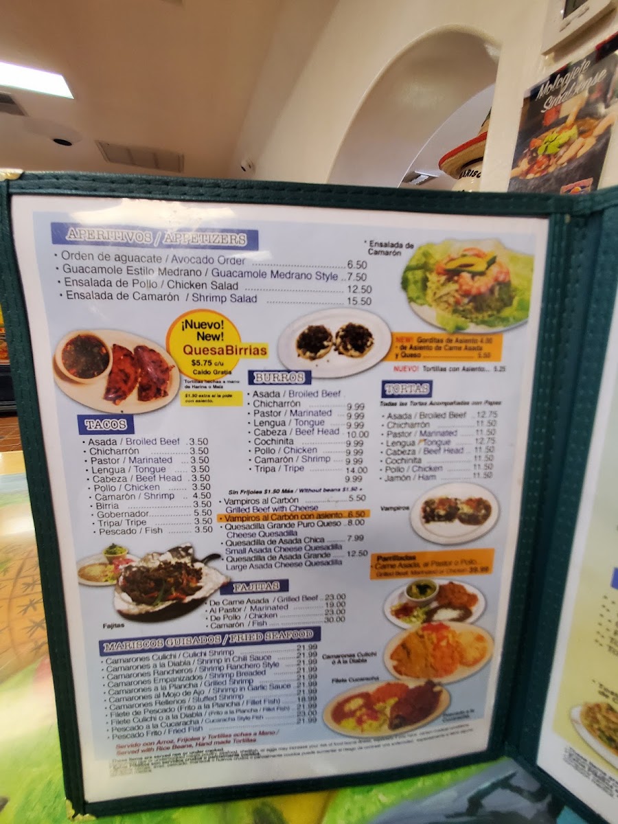 Tacos y Mariscos Sinaloa menu board