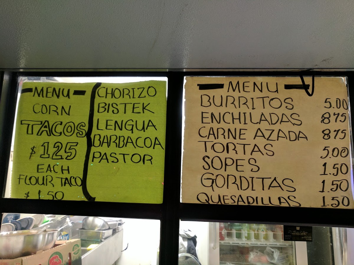 El Tio Tacos menu board
