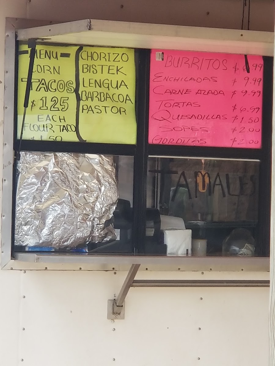 El Tio Tacos menu board