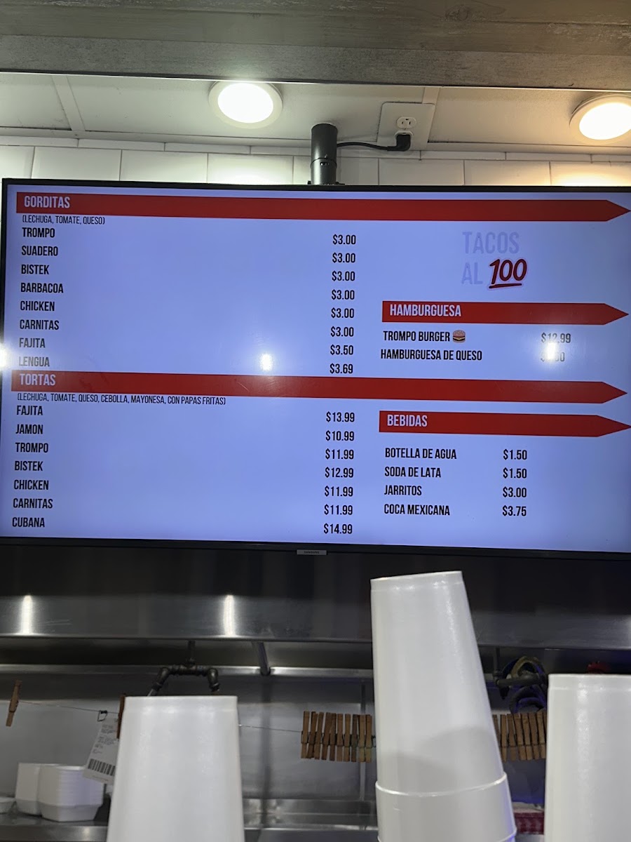 TACOS AL 100 menu board