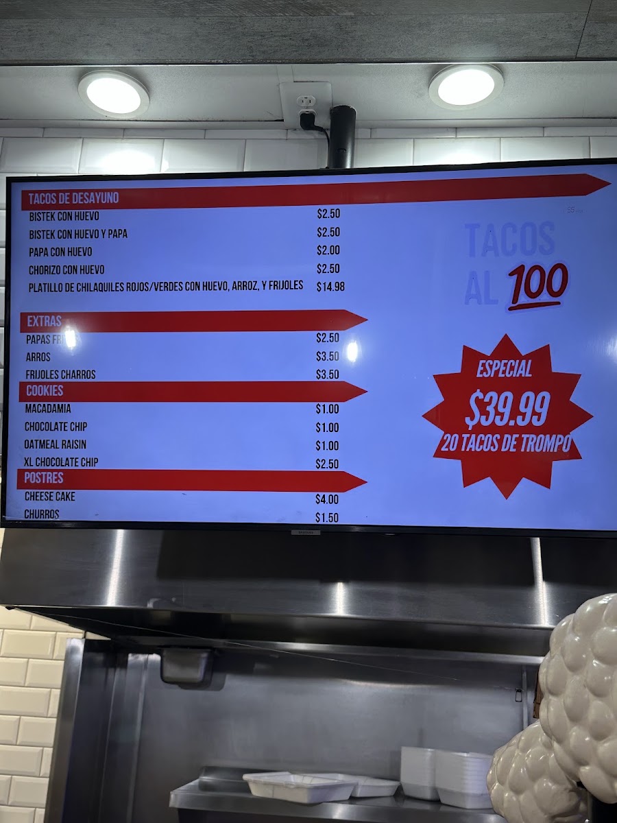 TACOS AL 100 menu board