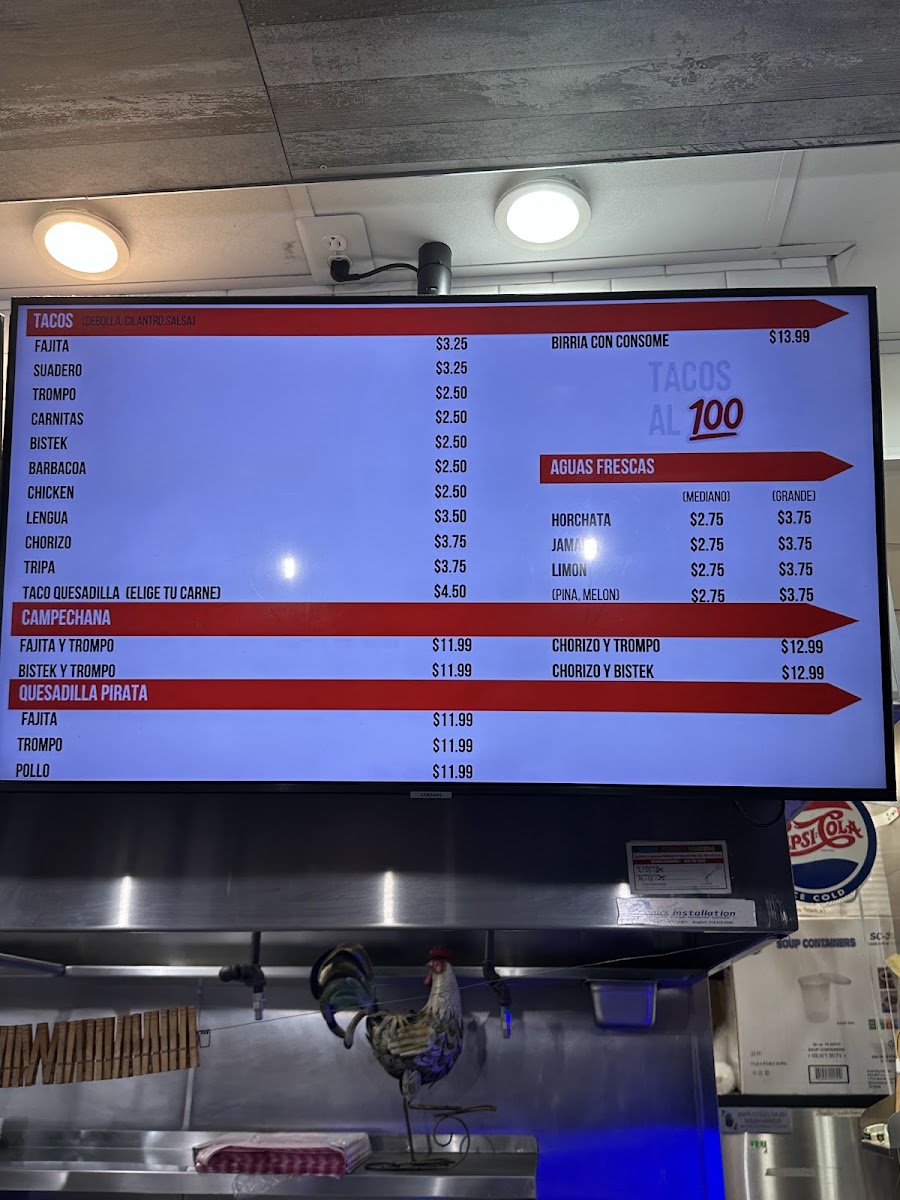 TACOS AL 100 menu board