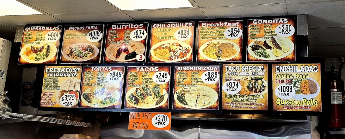 La Paisanita taqueria deli menu board