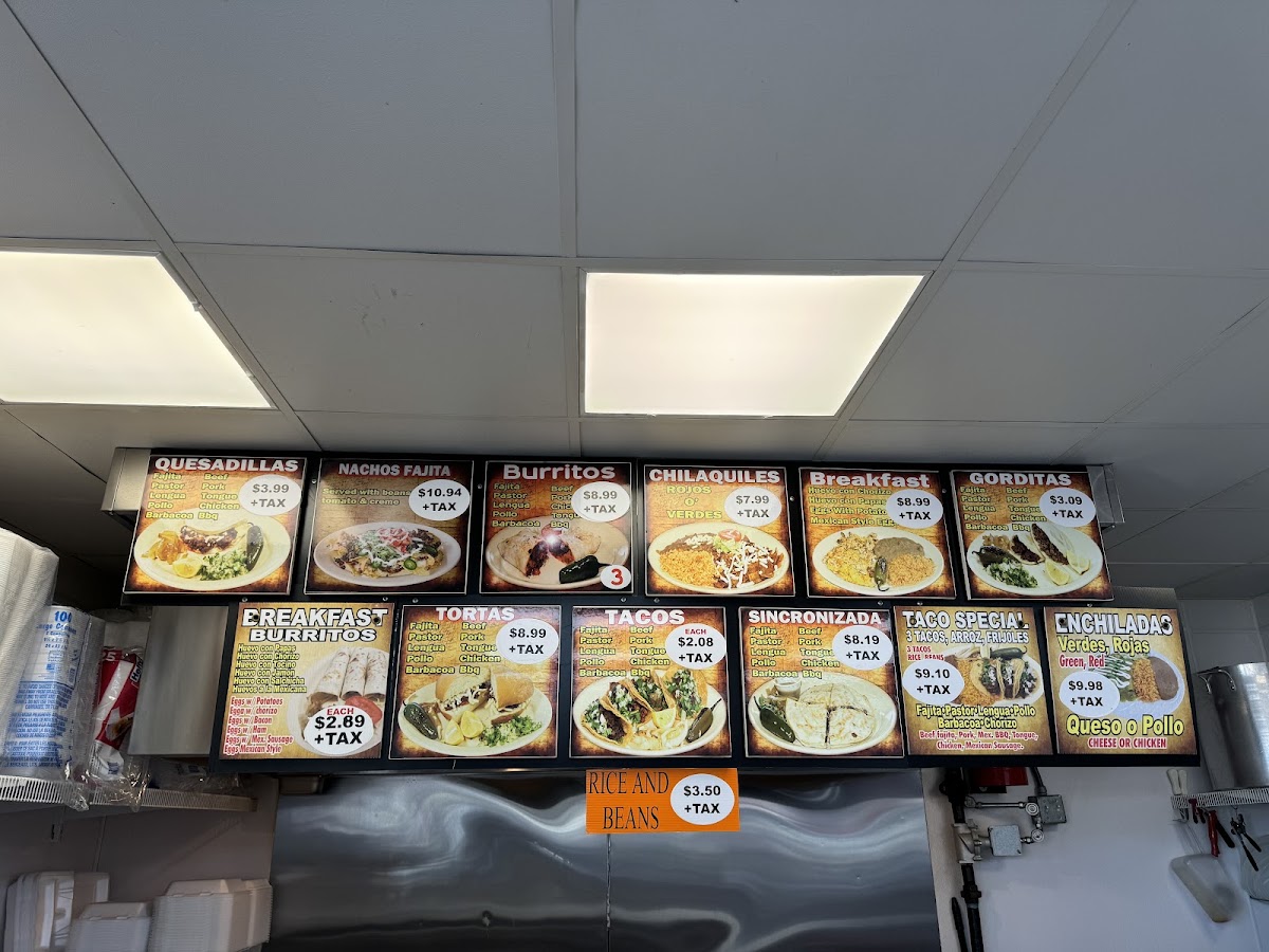 La Paisanita taqueria deli menu board