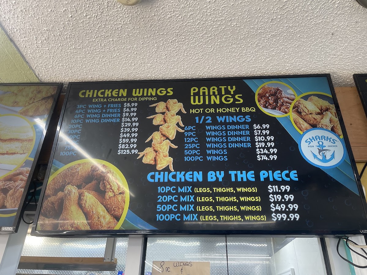 SHARKS FISH & CHIKEN menu board