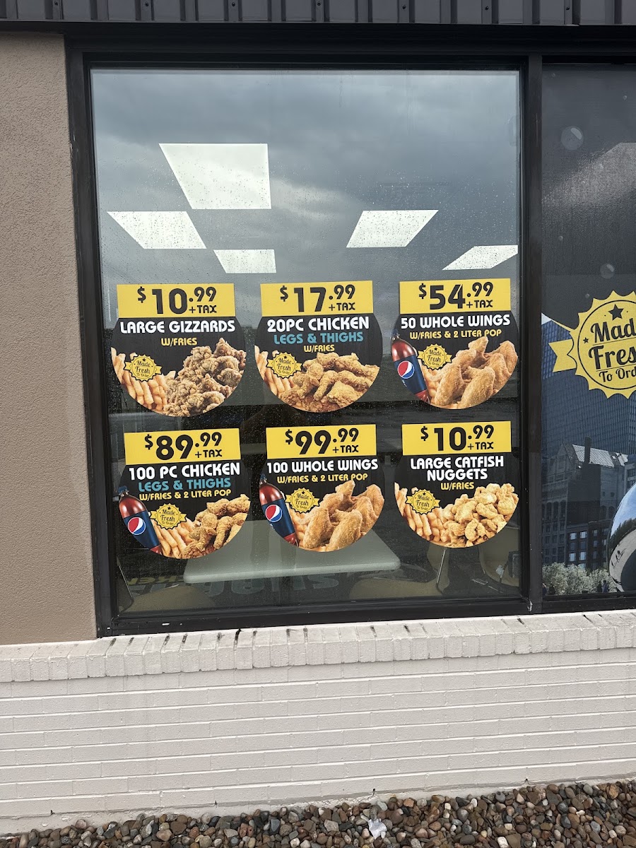 SHARKS FISH & CHIKEN menu board