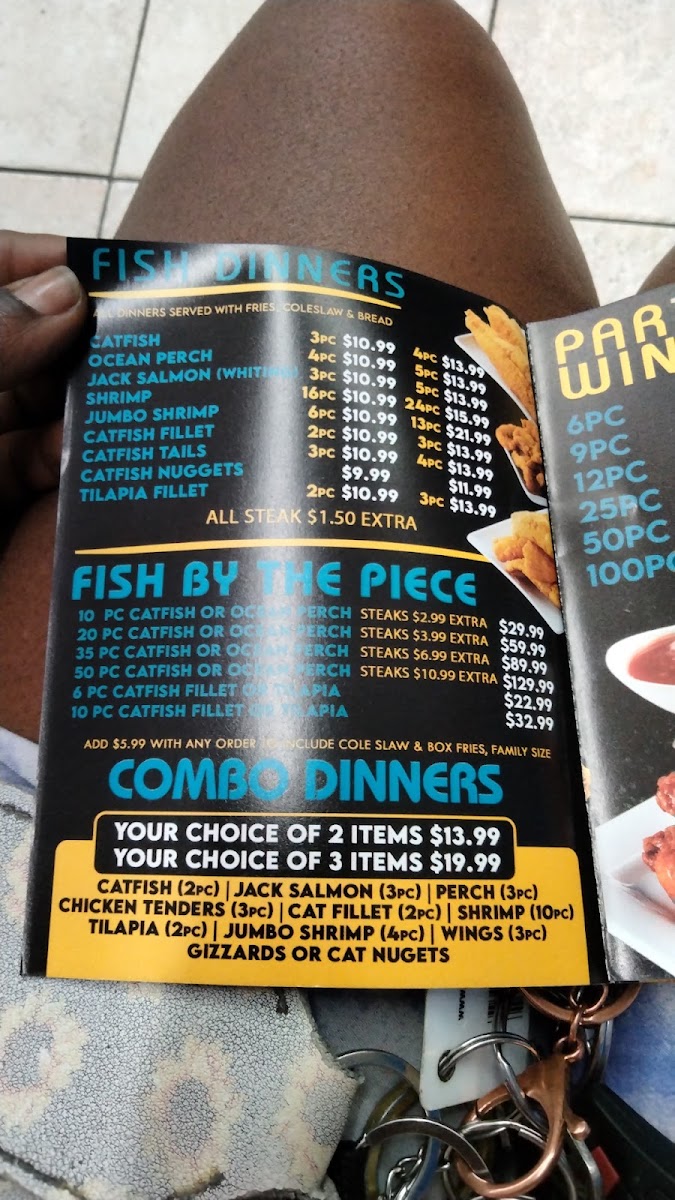 SHARKS FISH & CHIKEN menu board