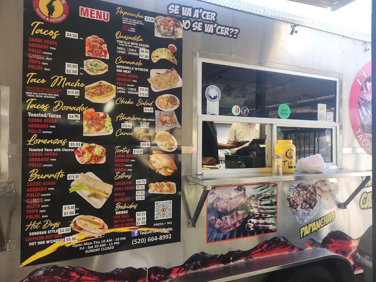 Taquería el Cheke menu board
