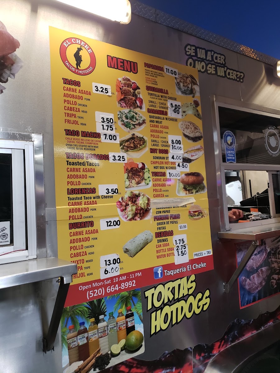 Taquería el Cheke menu board