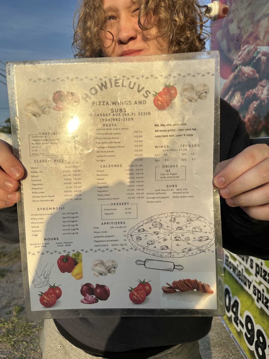 Howieluv's Pizza Wings And Subs menu board