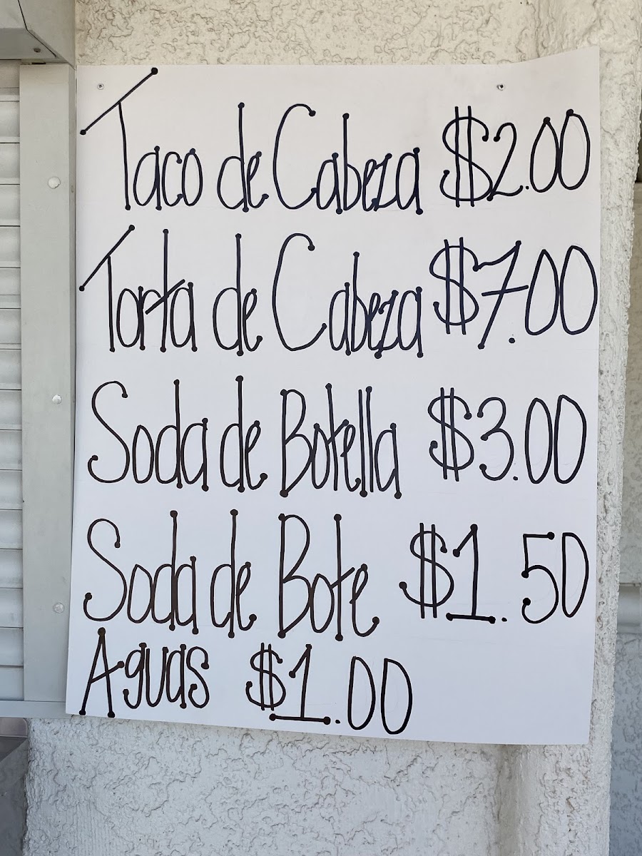 JV Tacos Y Hot Dogs menu board
