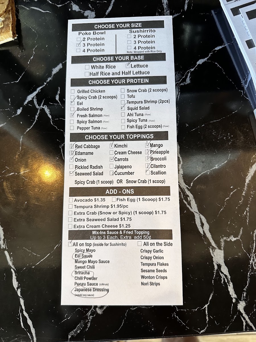 Ginza Ramen and Poke menu board