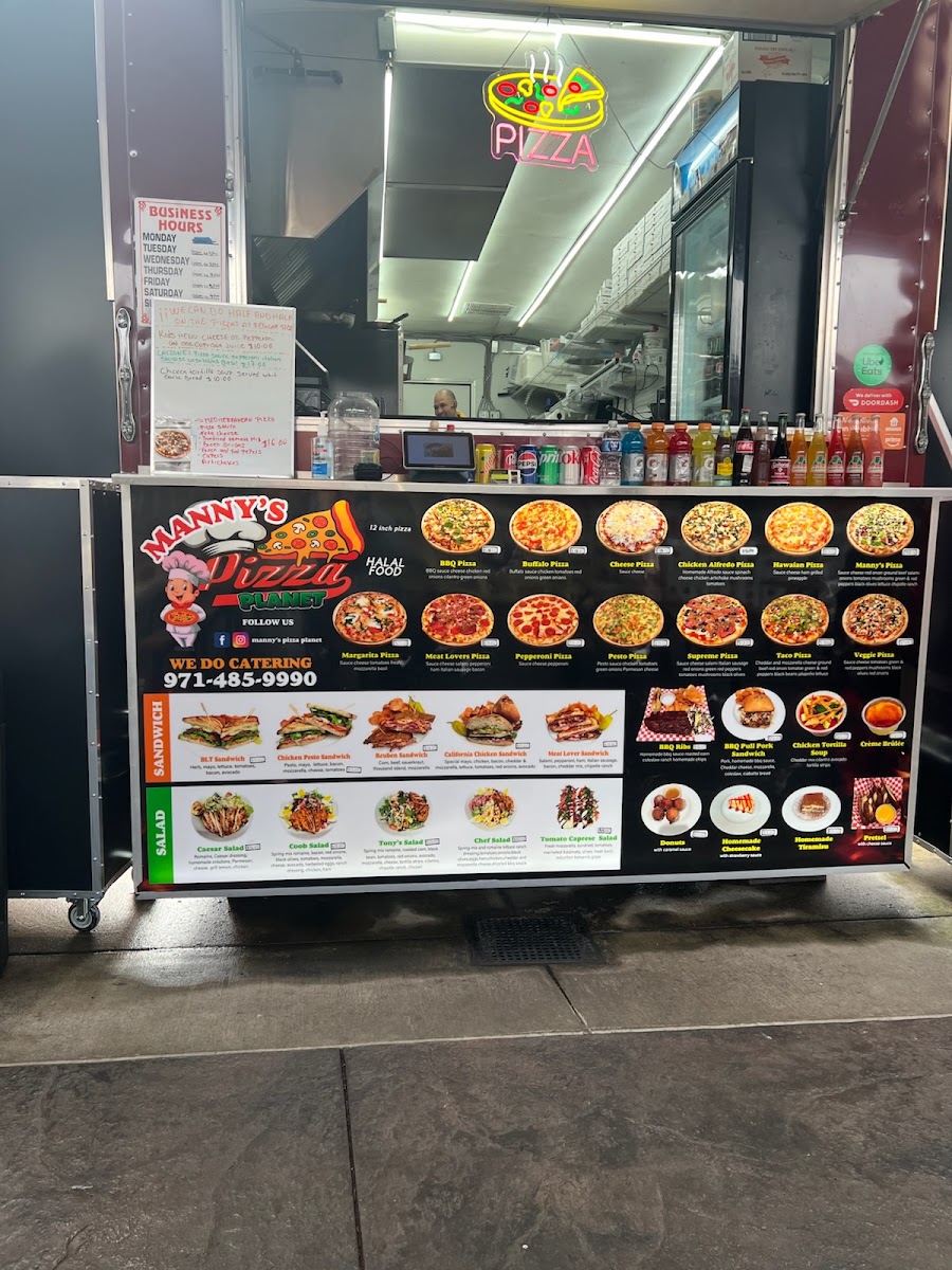 Manny's Pizza Planet Restaurante & Catering menu board