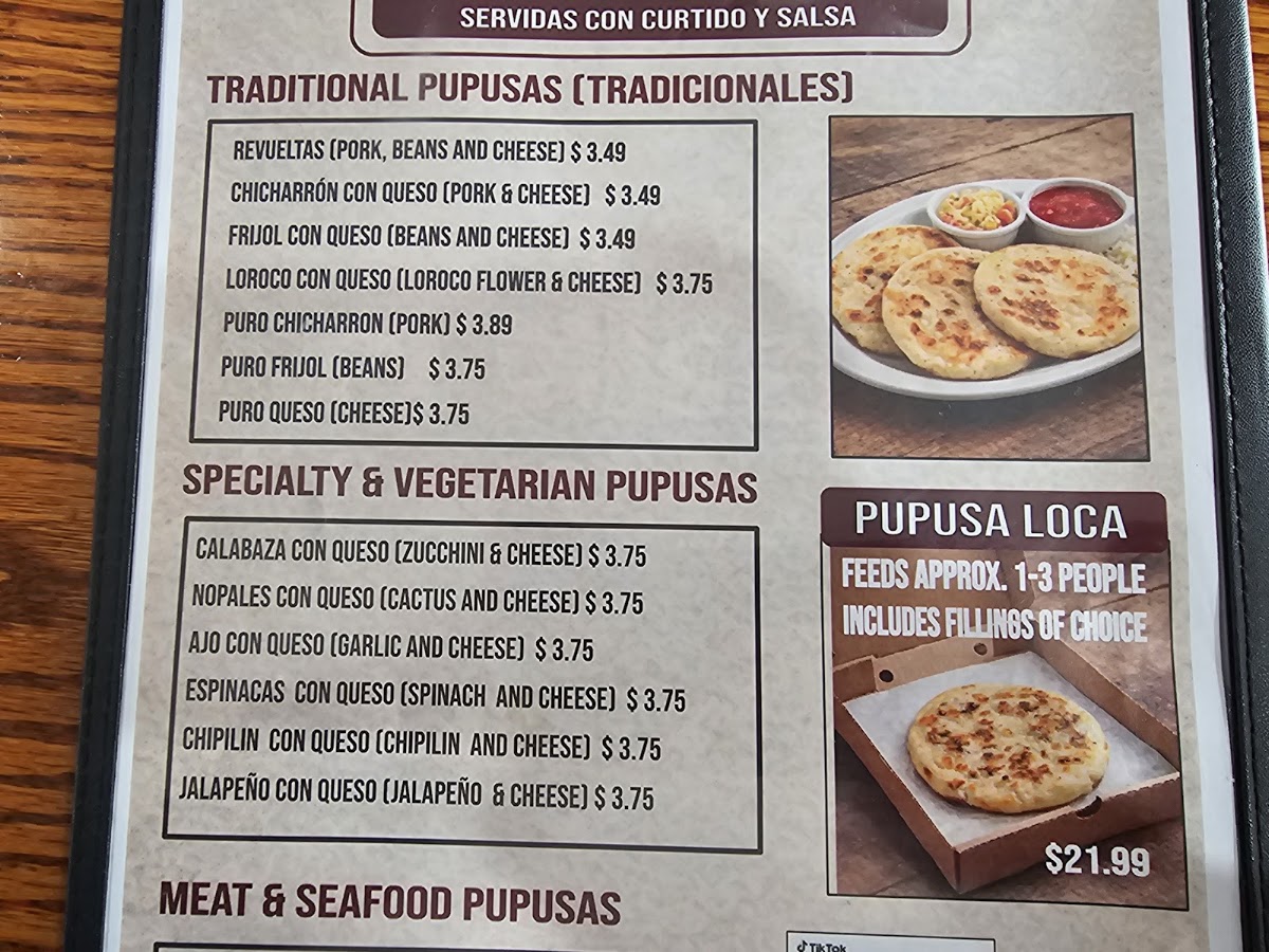 Pupuseria Villanueva menu board