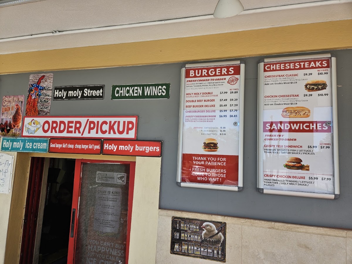 Holy Moly Burgers & the Bird menu board