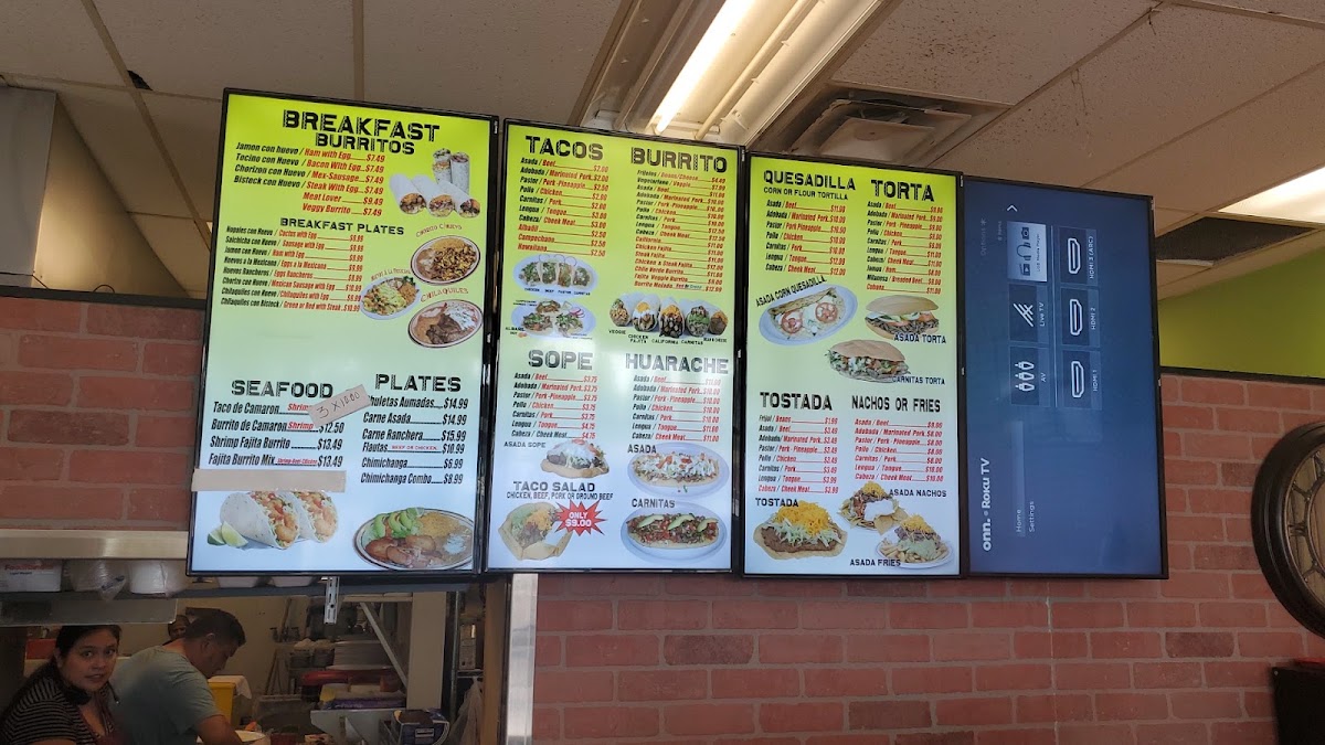 Taqueria El Molcajete menu board