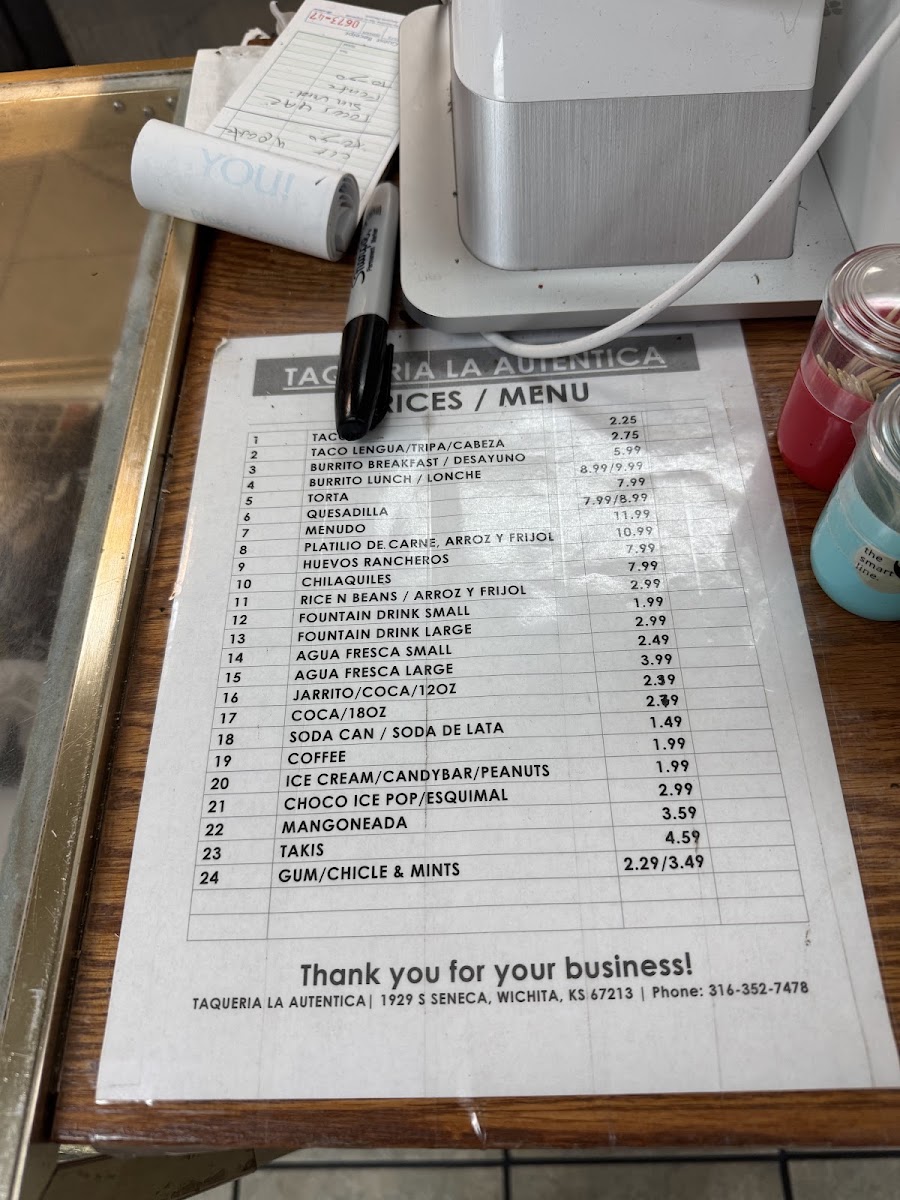 Taquería La Autentica menu board