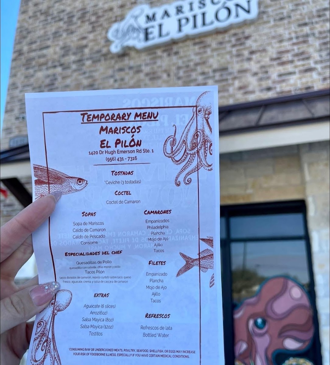 Mariscos El Pilón menu board