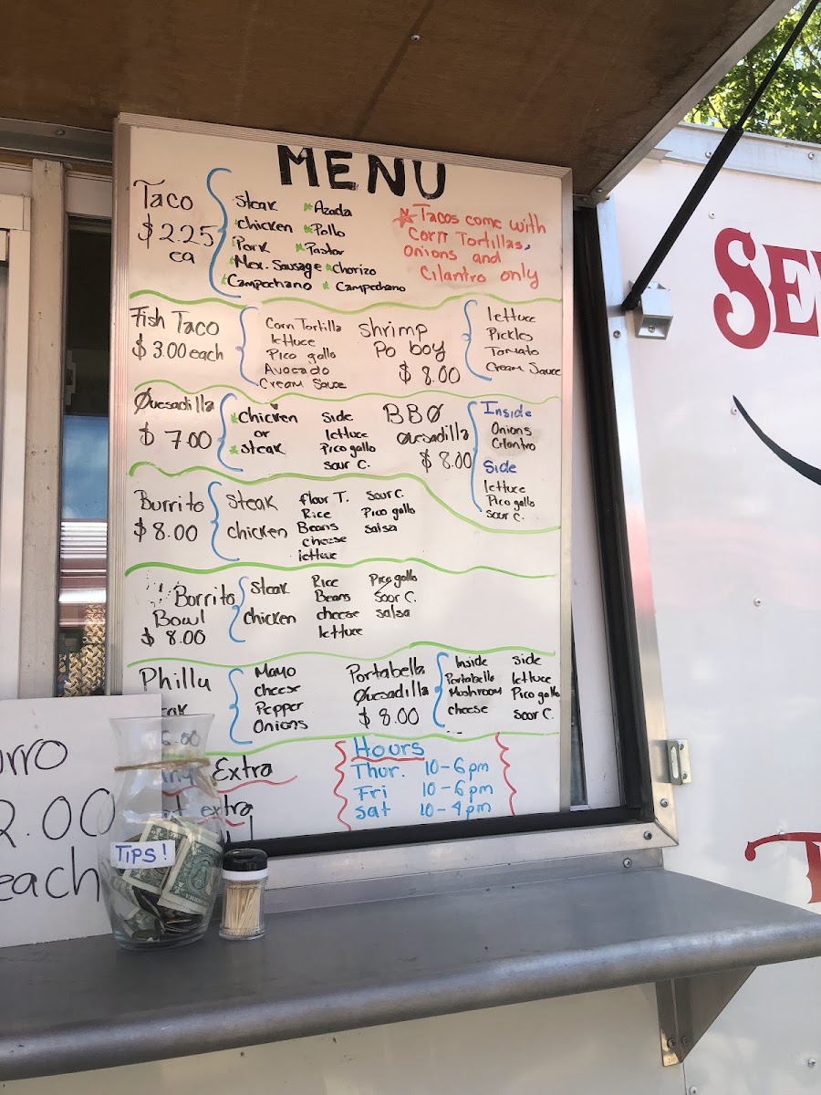 Seven Den Tacos menu board