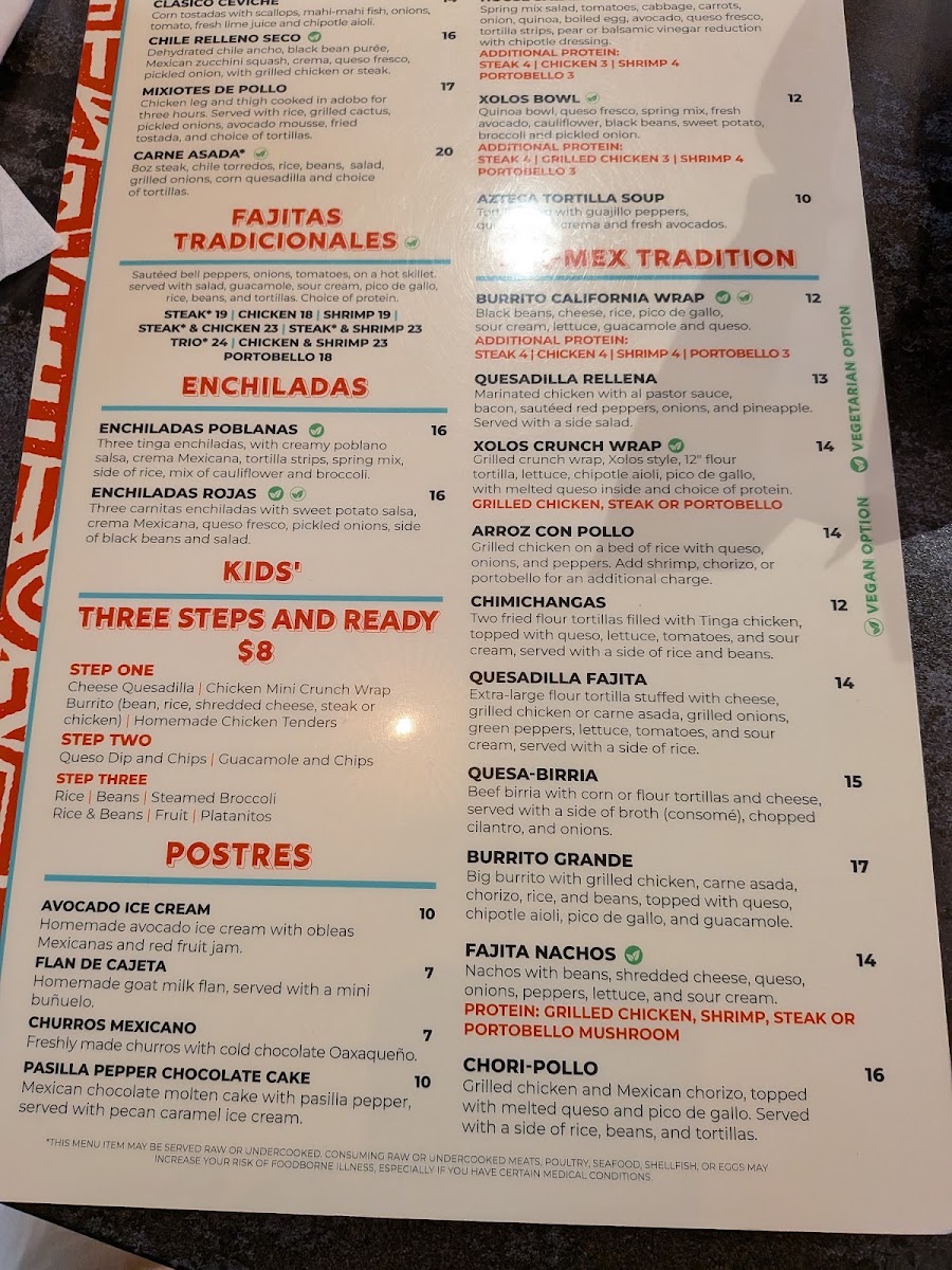 Xolos Tacos Y Tlayudas menu board