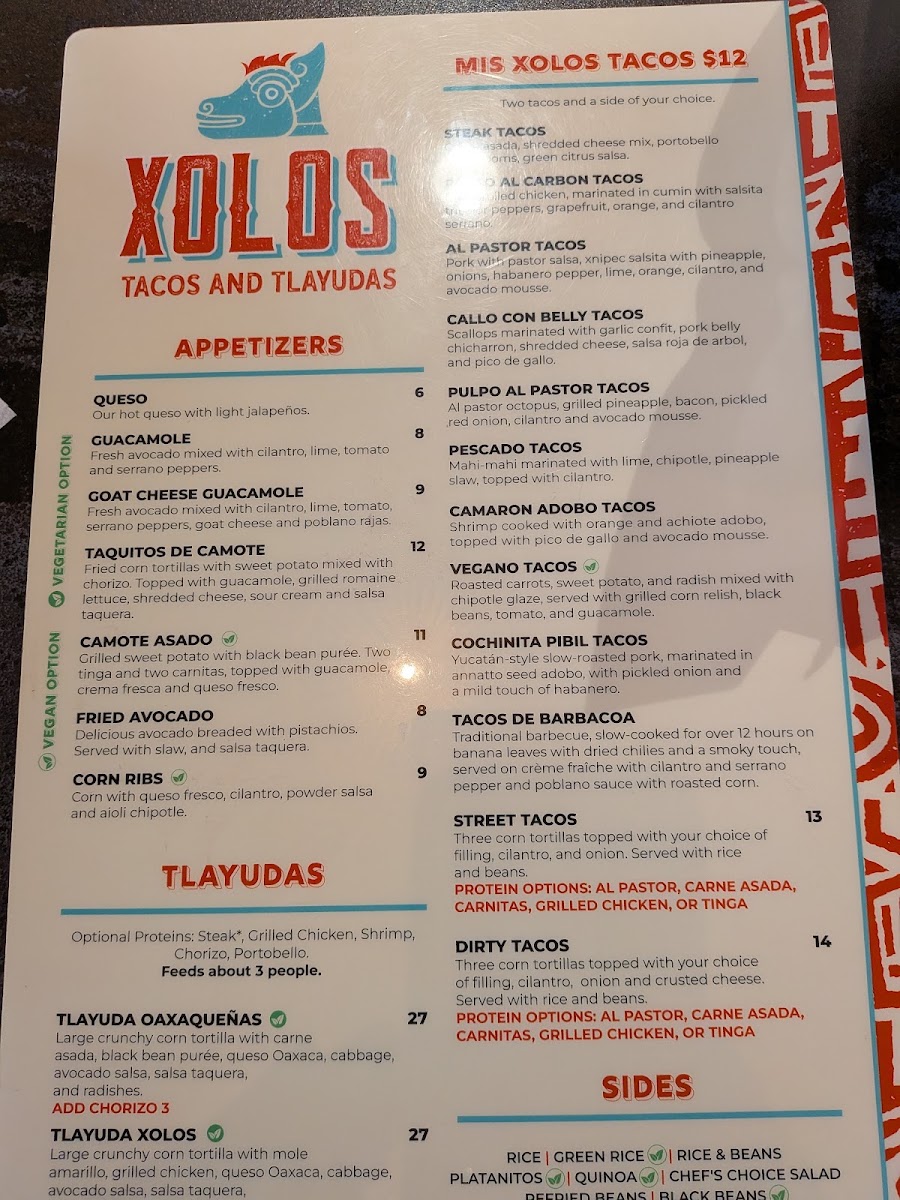 Xolos Tacos Y Tlayudas menu board