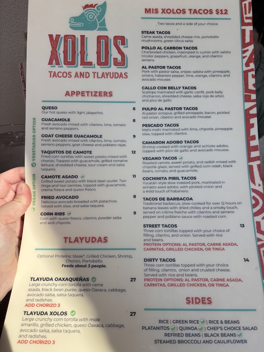 Xolos Tacos Y Tlayudas menu board