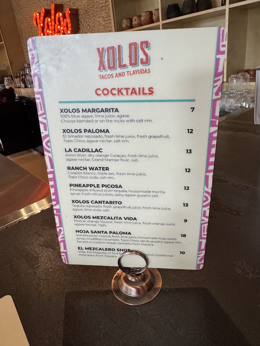 Xolos Tacos Y Tlayudas menu board