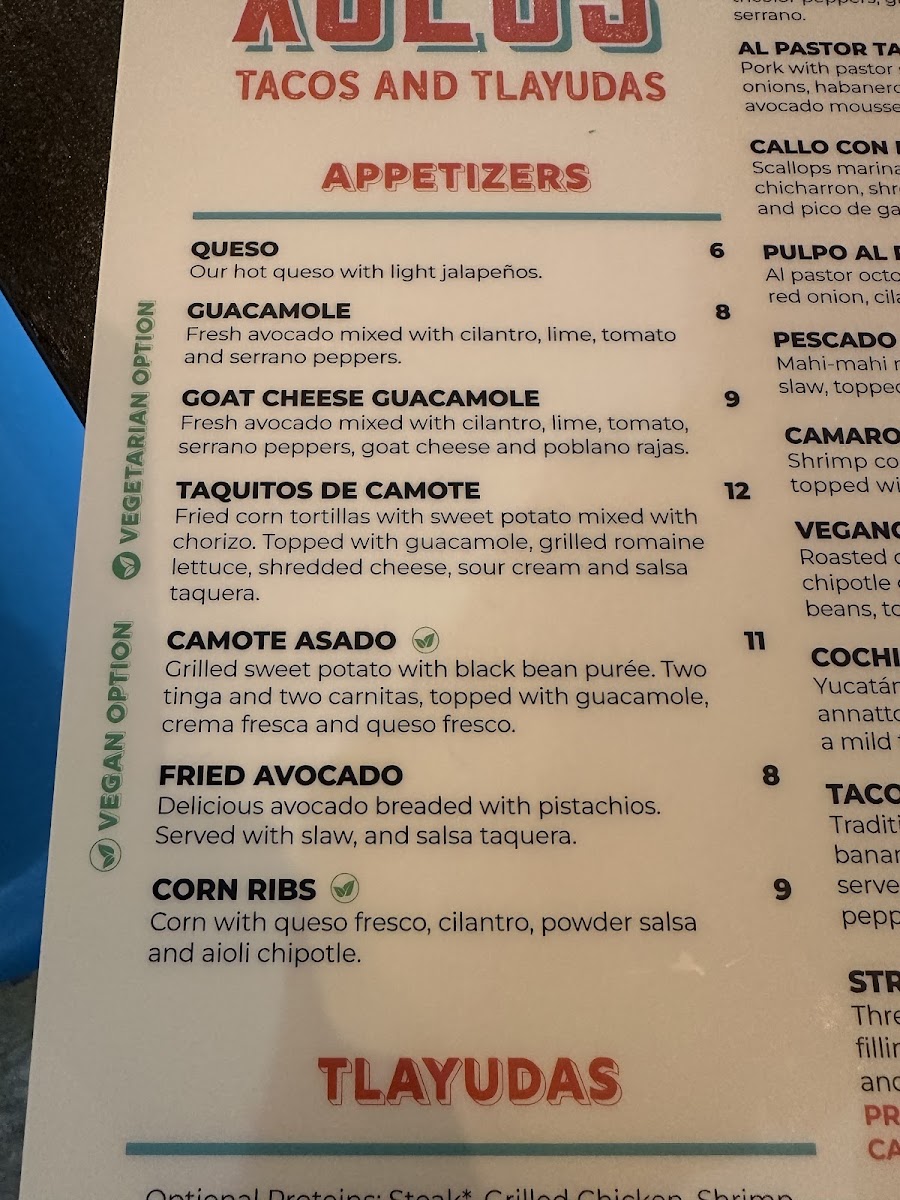 Xolos Tacos Y Tlayudas menu board