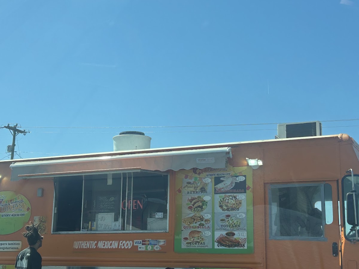 Tacos & Mariscos Dilcia’s Food Truck menu board