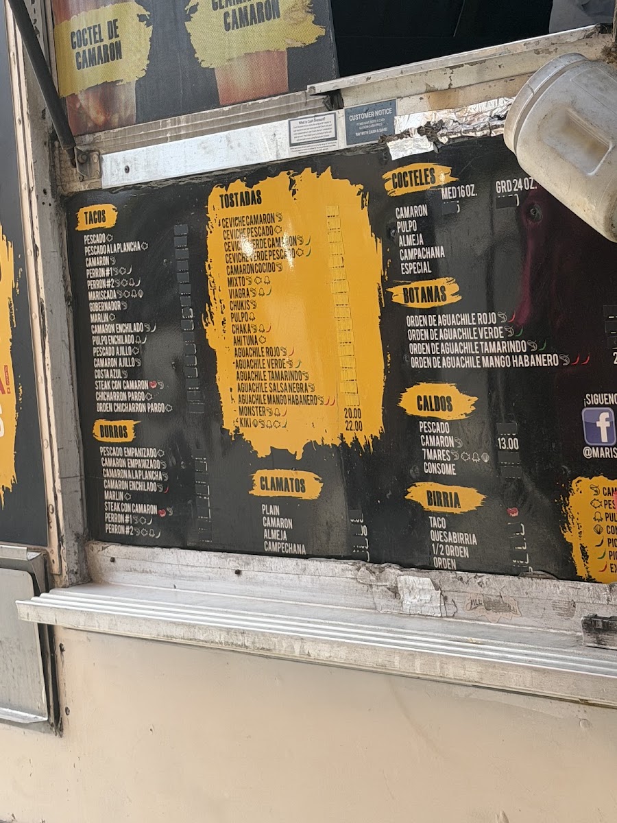 Taqueria y mariscos el kiki menu board