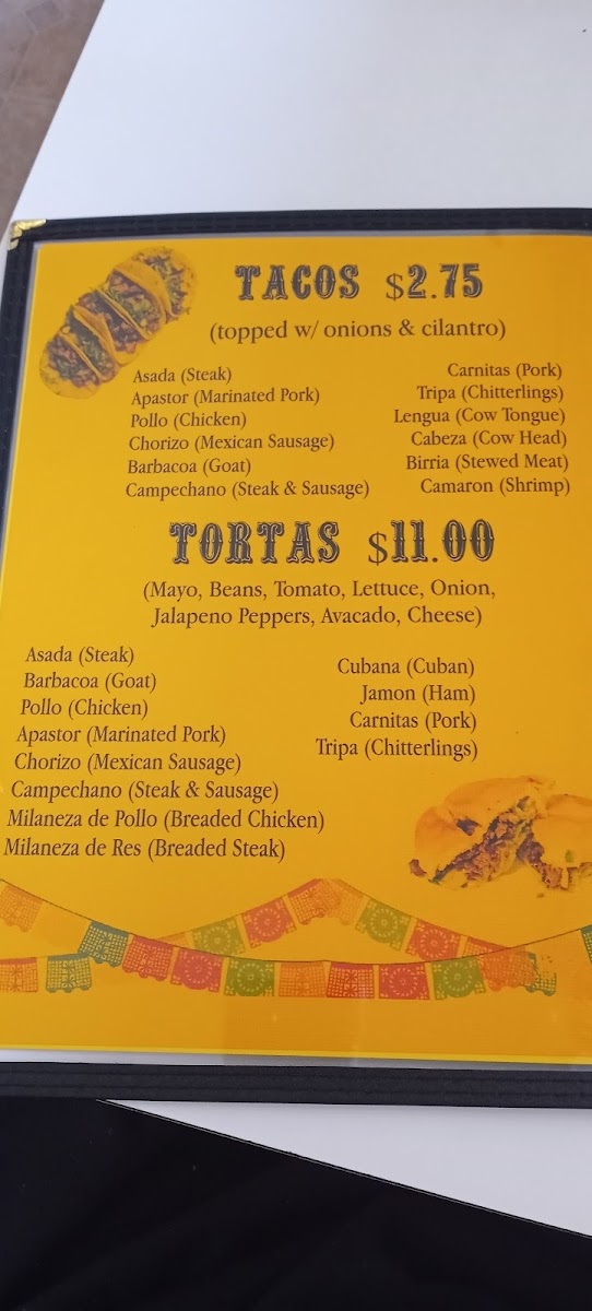 Taquería Milagro menu board