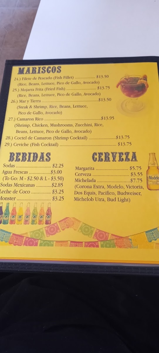 Taquería Milagro menu board