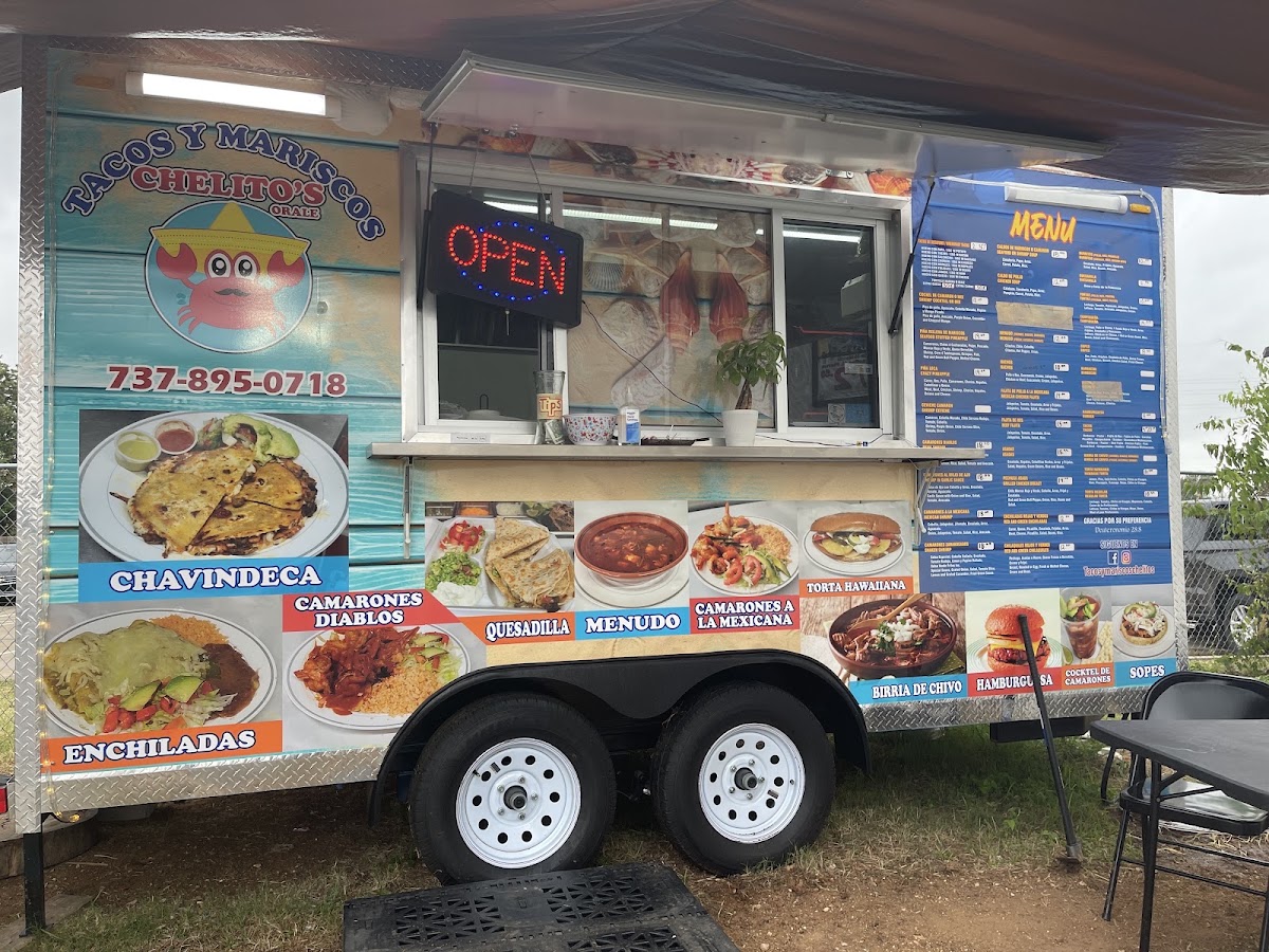 Tacos & Mariscos chelito's menu board