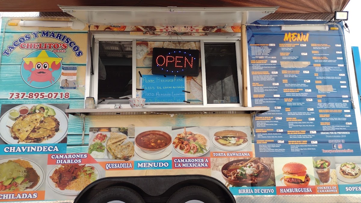 Tacos & Mariscos chelito's menu board