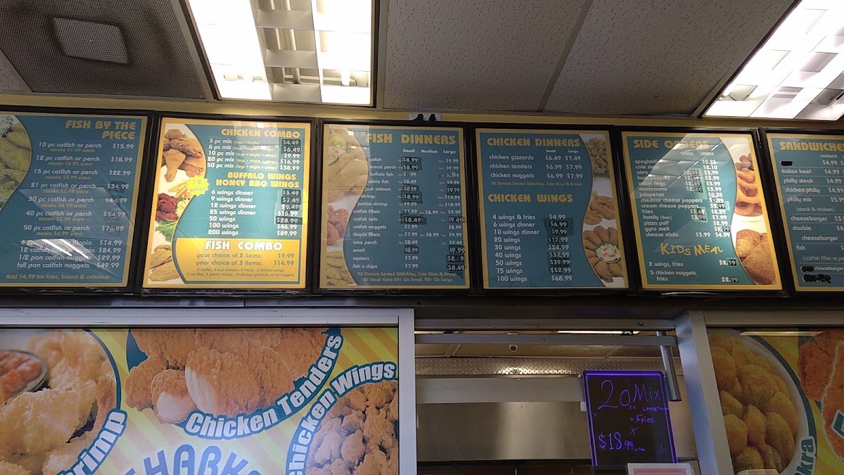Shark's Fish & Chicken menu board