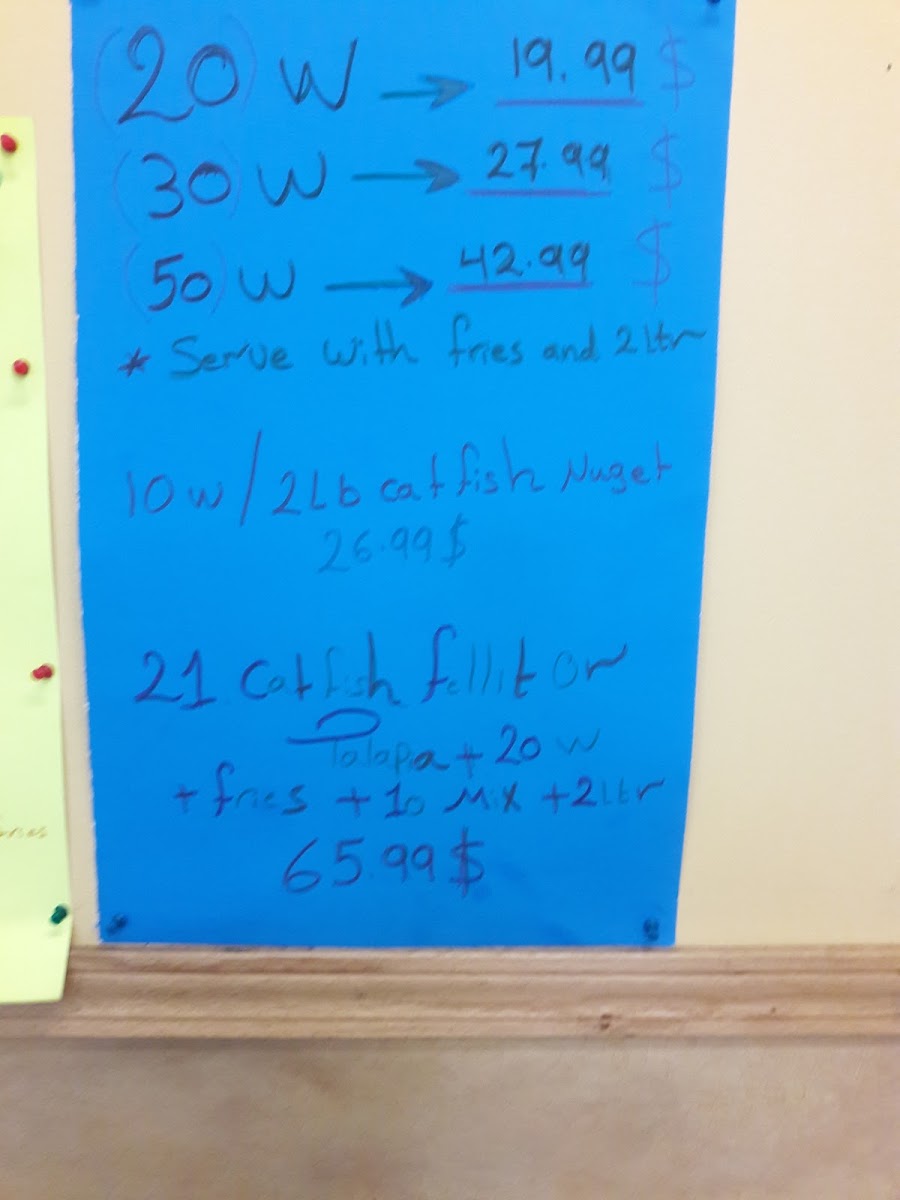 Shark's Fish & Chicken menu board