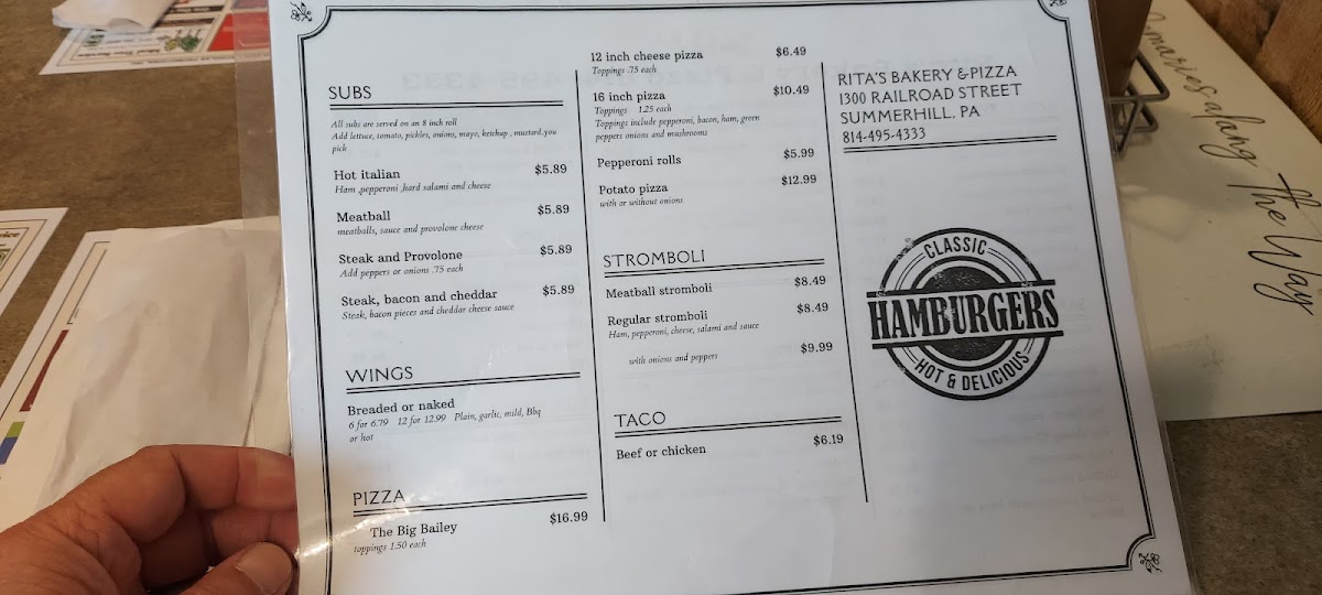 Rita's Bakery & Pizza menu board